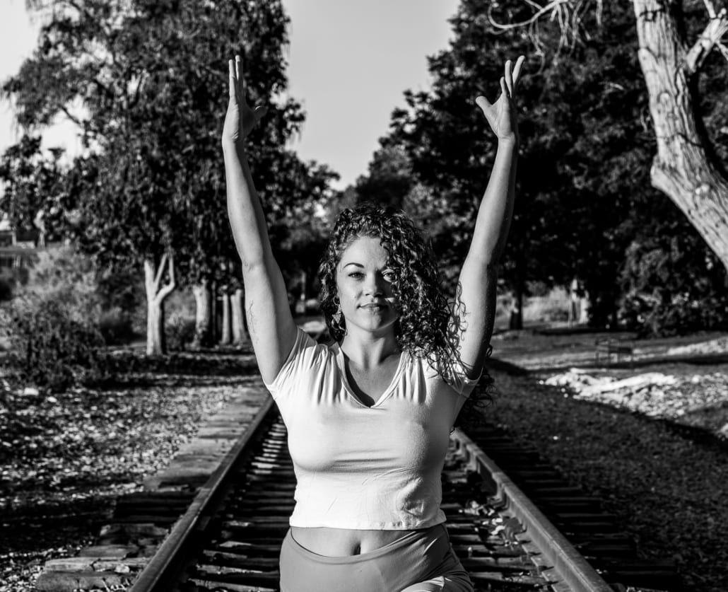 Underground yoga on the railroad tracks.