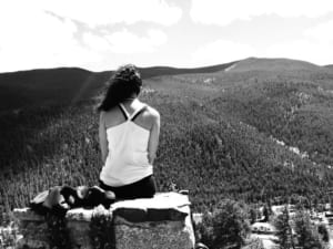 Woman takes in the view while on a yoga retreat.